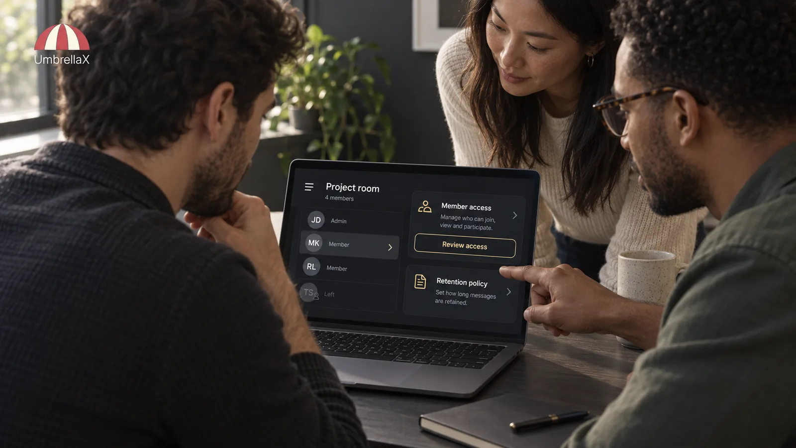 Colleagues review membership and access to a private project room on a laptop.